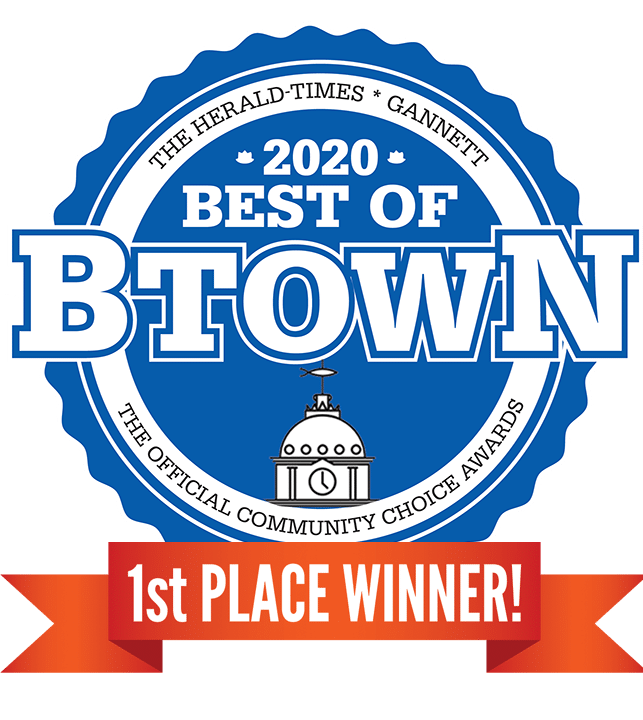 a blue and white circle with white text and a round building with a red ribbon 2020 Best Of Brown award