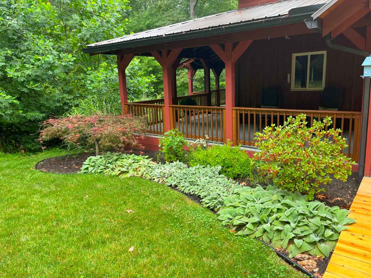 A landscaped yard and flowerbed outside a home in Unionville